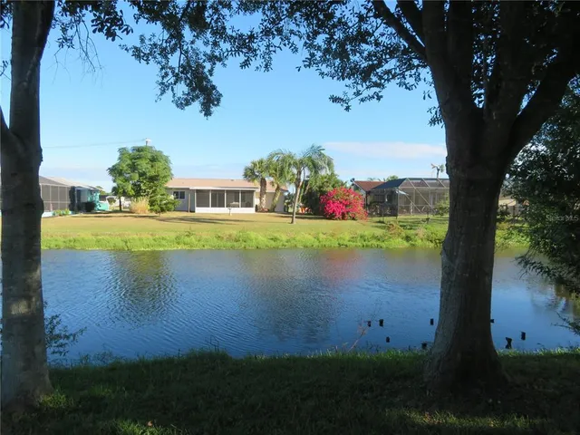 a view of a lake with a yard