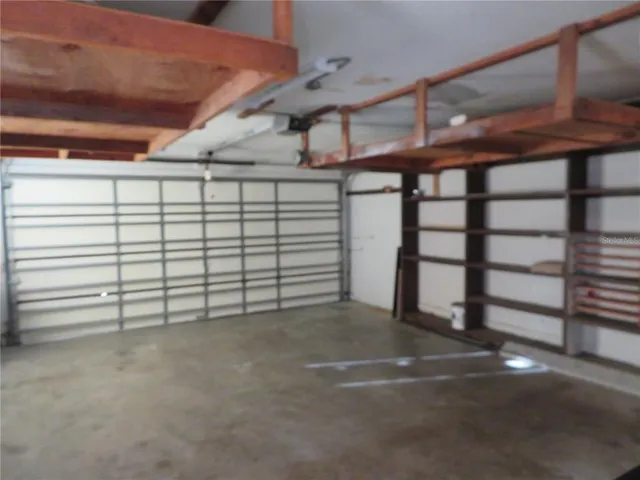 a view of a house with backyard porch and garden