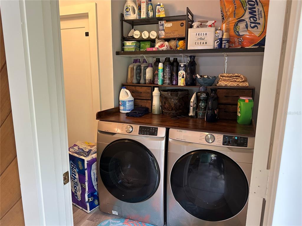 9781 West Halls River Road Homosassa, FL 34448 - Photo 23 of 59 a utility room with dryer and washer