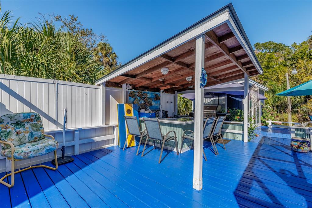 9781 West Halls River Road Homosassa, FL 34448 - Photo 31 of 59 a view of a chairs and table in a patio