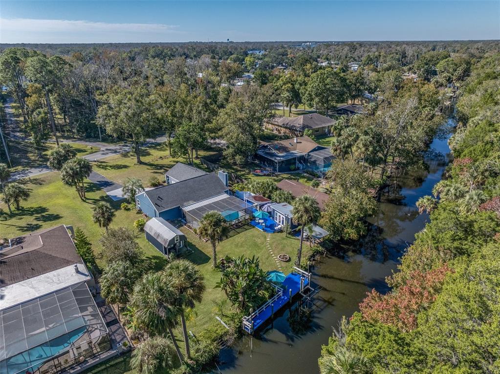 9781 West Halls River Road Homosassa, FL 34448 - Photo 51 of 59 an aerial view of a house with a yard