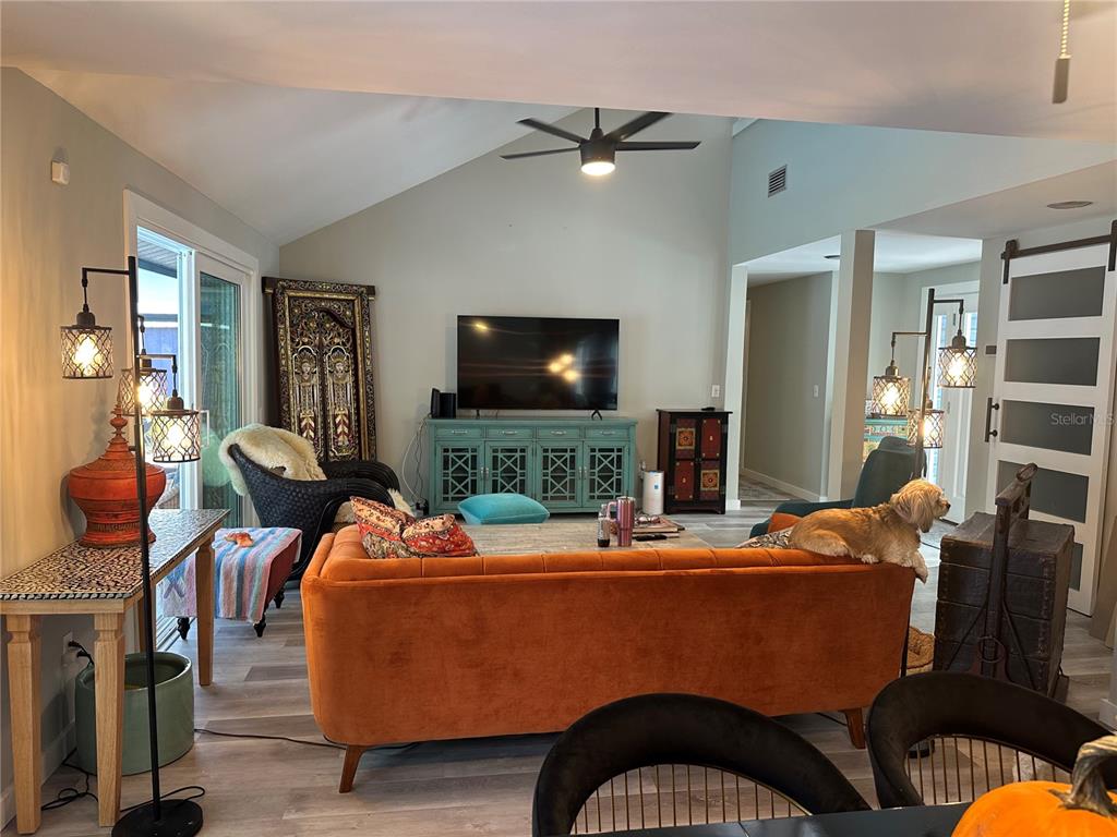 9781 West Halls River Road Homosassa, FL 34448 - Photo 7 of 59 a room with furniture and a flat screen tv