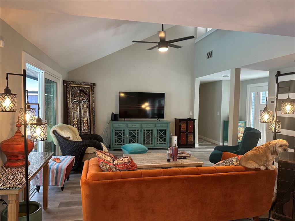 9781 West Halls River Road Homosassa, FL 34448 - Photo 8 of 59 a living room with furniture and a flat screen tv