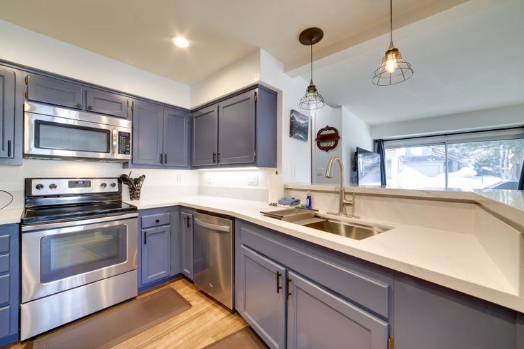 591 Golden Creek Road, Unit 591 Mammoth Lakes, CA 93546 - Photo 10 of 19 a kitchen with a sink stove and microwave