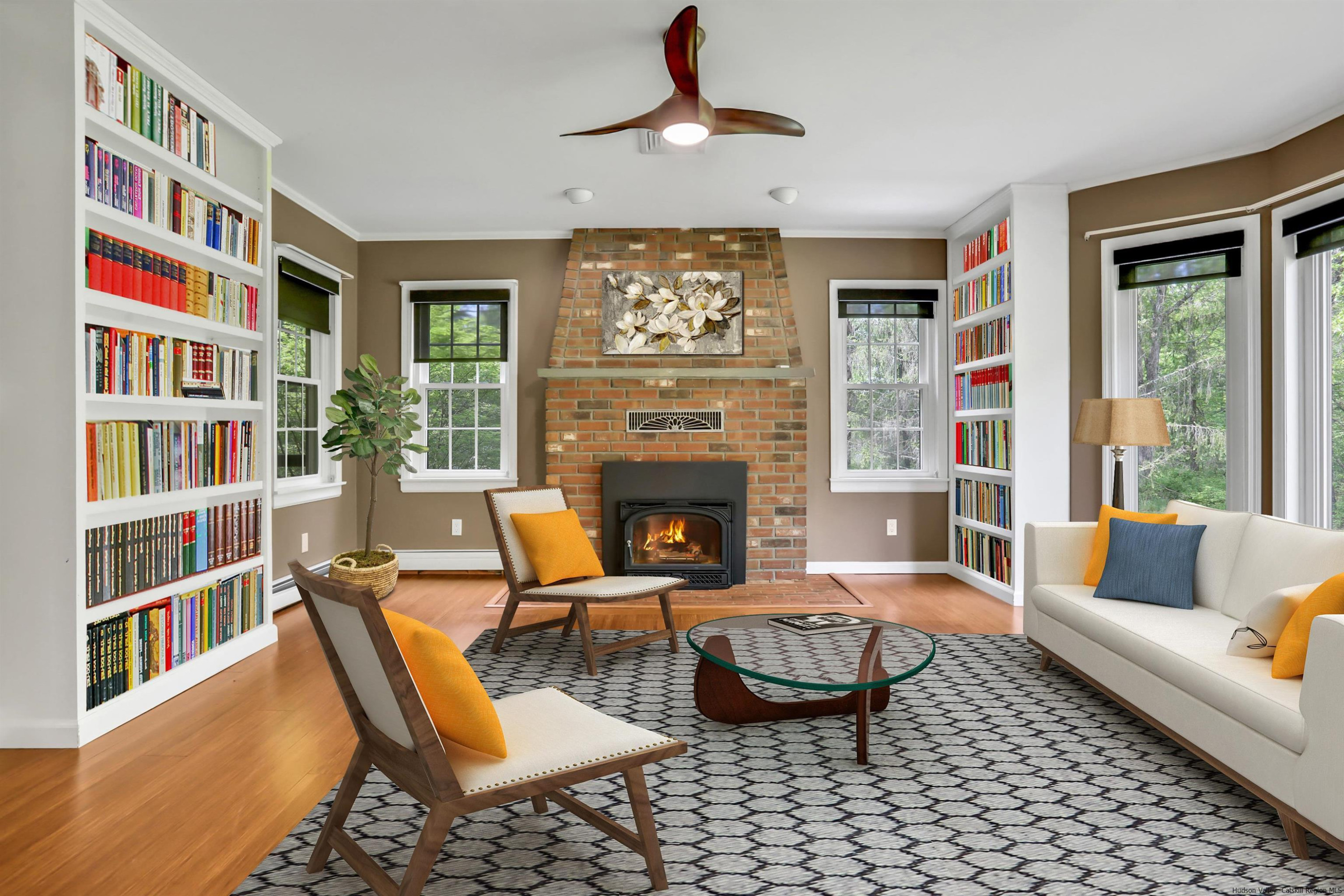 1 High Ridge Road, Unit KLEINKILL DR New Paltz, NY 12561 - Photo 11 of 30 a living room with furniture a bookshelf and a fireplace