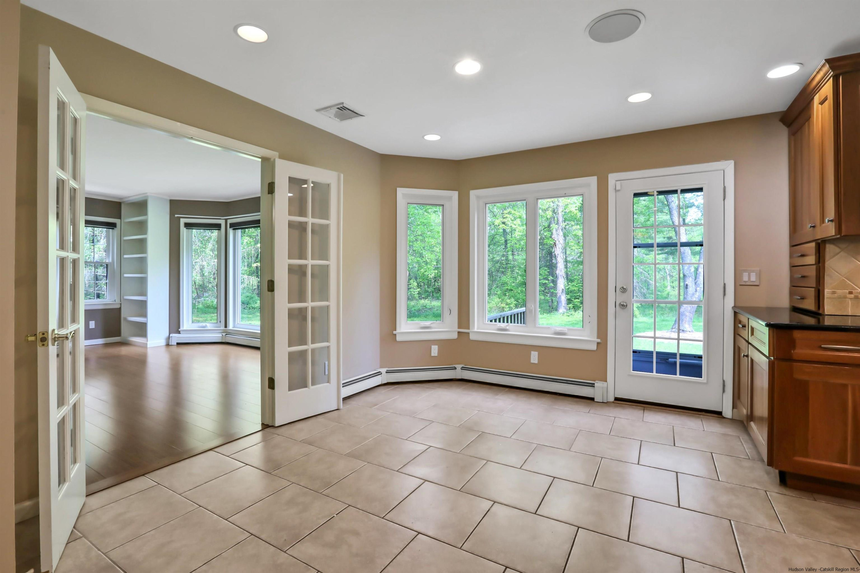 1 High Ridge Road, Unit KLEINKILL DR New Paltz, NY 12561 - Photo 14 of 30 a view of an empty room with a fireplace and a large window