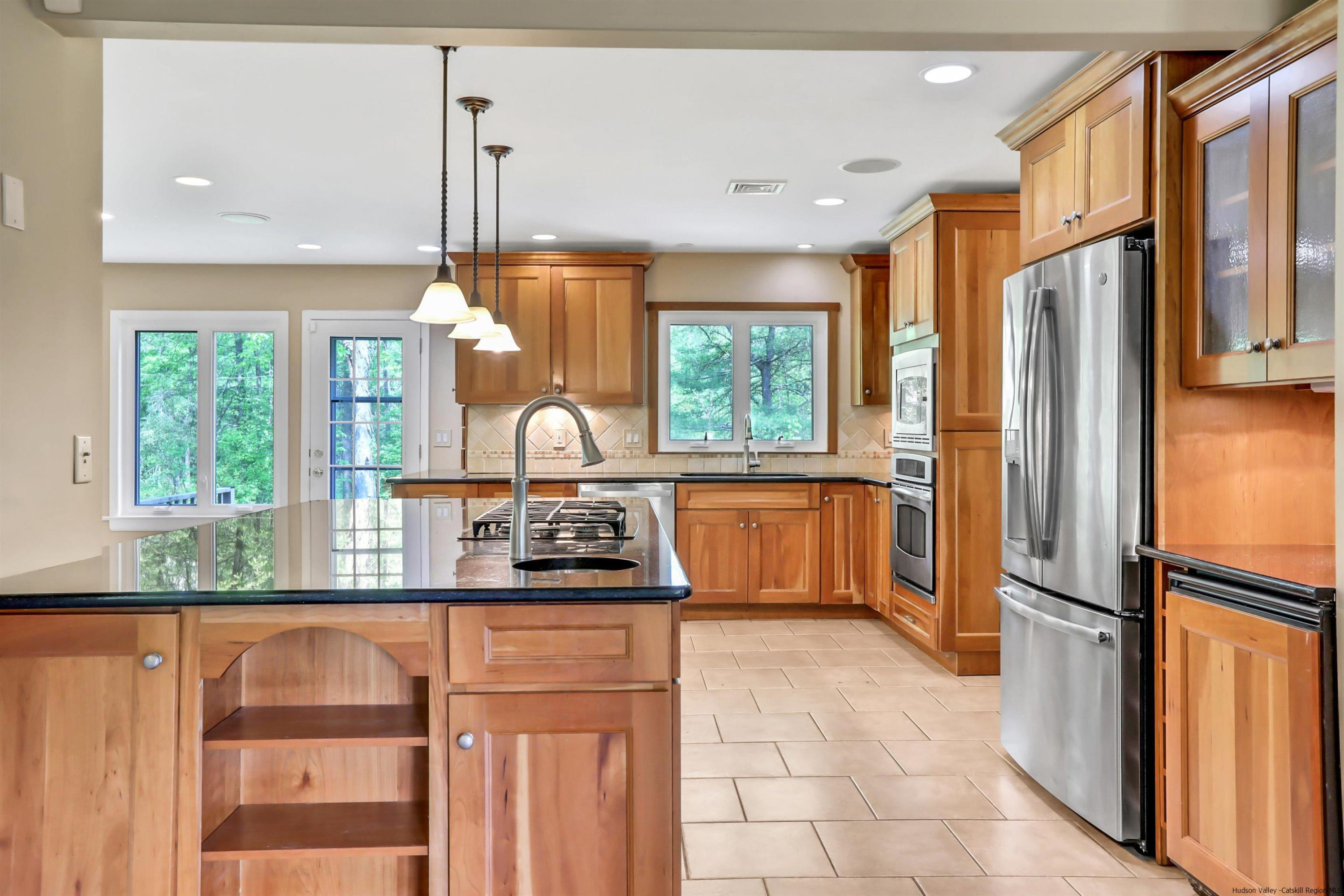 1 High Ridge Road, Unit KLEINKILL DR New Paltz, NY 12561 - Photo 16 of 30 a kitchen with stainless steel appliances granite countertop a refrigerator a sink a stove and a window