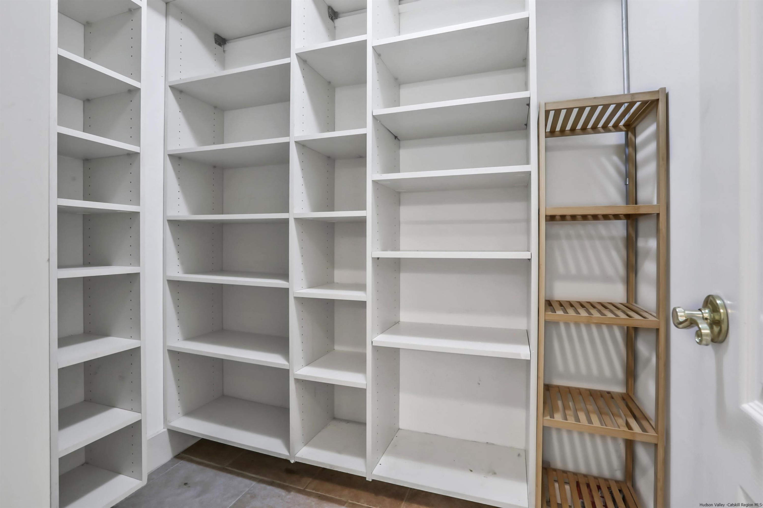 1 High Ridge Road, Unit KLEINKILL DR New Paltz, NY 12561 - Photo 18 of 30 a view of walk in closet with empty racks
