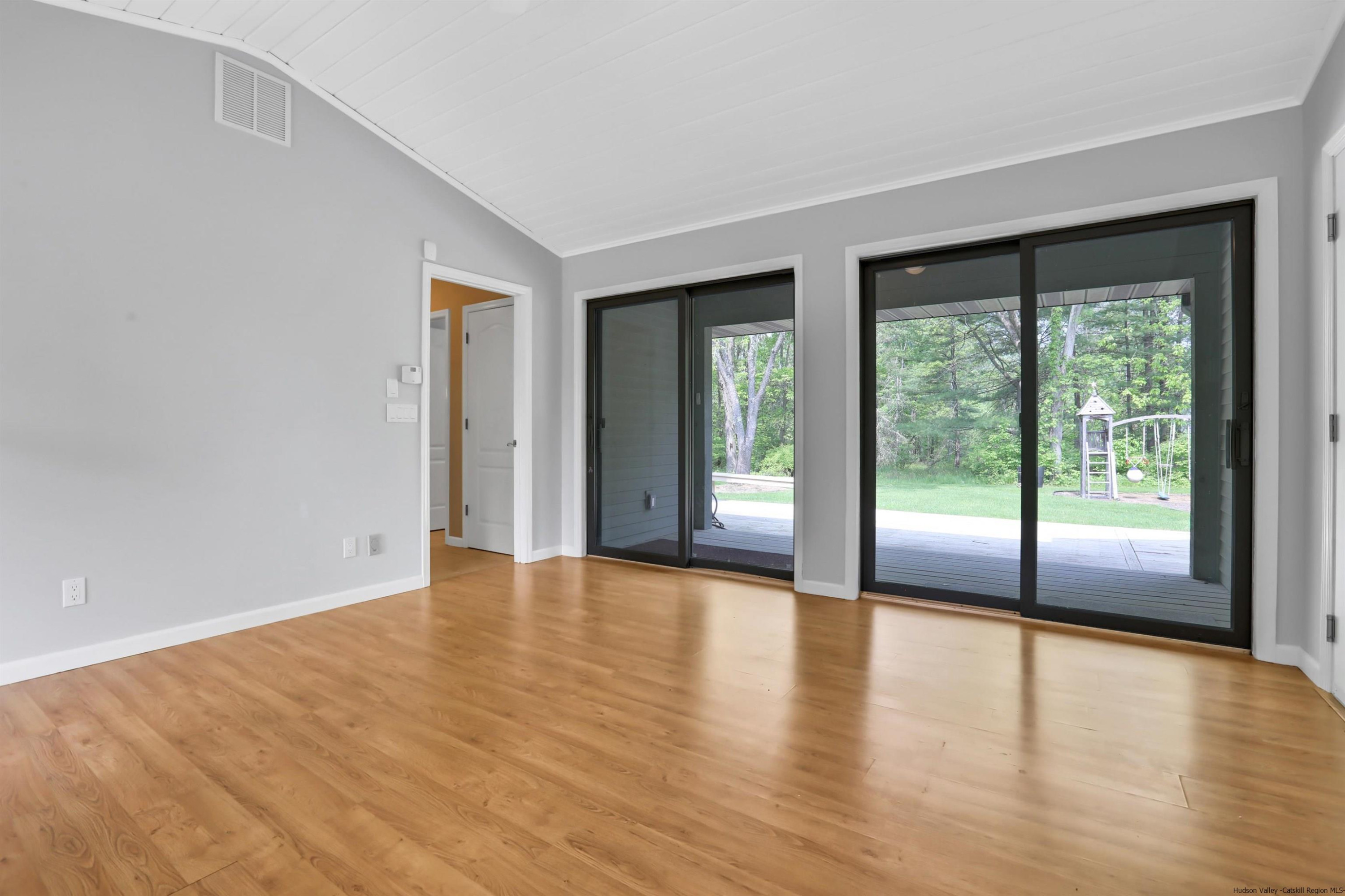 1 High Ridge Road, Unit KLEINKILL DR New Paltz, NY 12561 - Photo 19 of 30 a view of an empty room with wooden floor and a window
