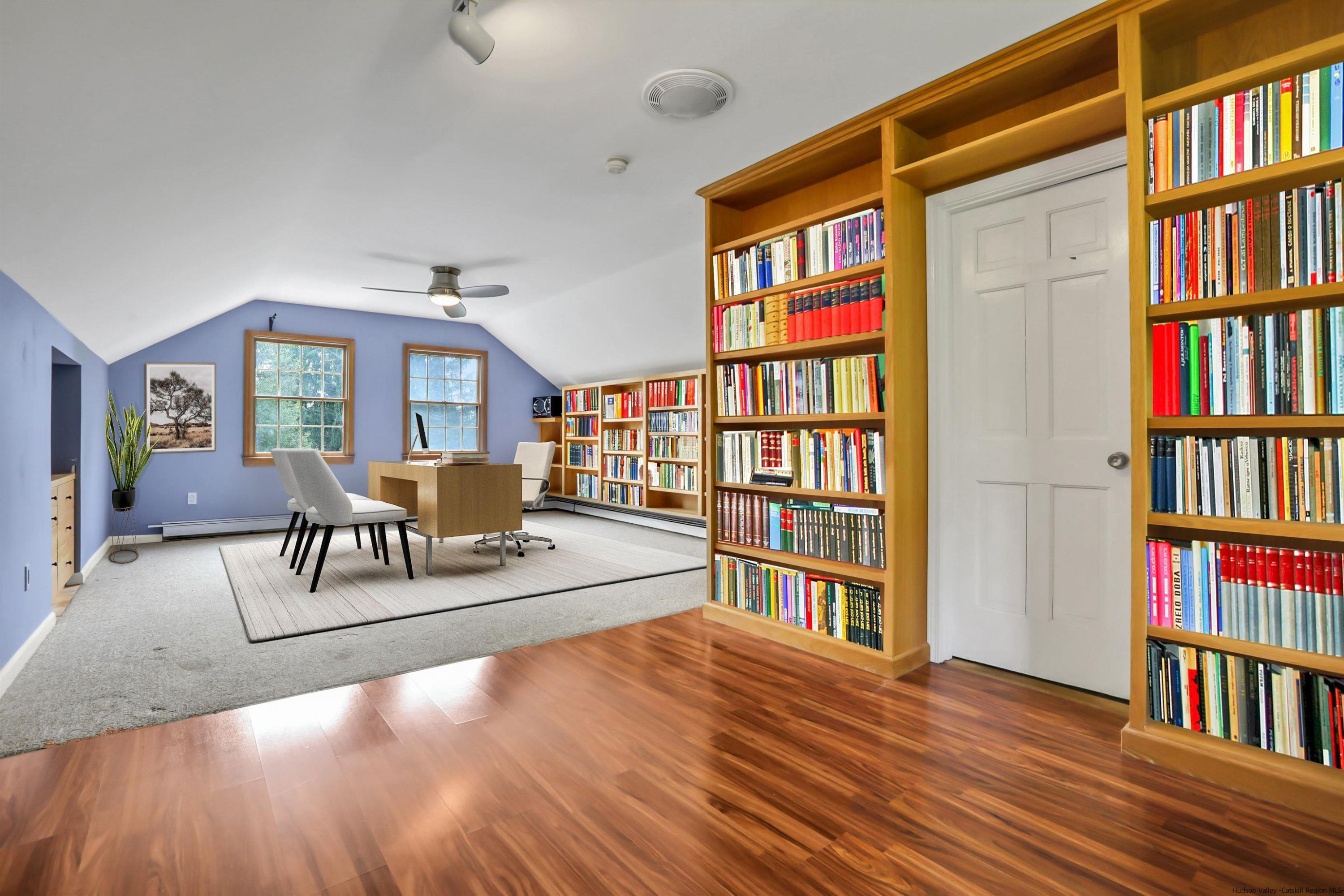 1 High Ridge Road, Unit KLEINKILL DR New Paltz, NY 12561 - Photo 28 of 30 a living room with a book shelf and a book shelf