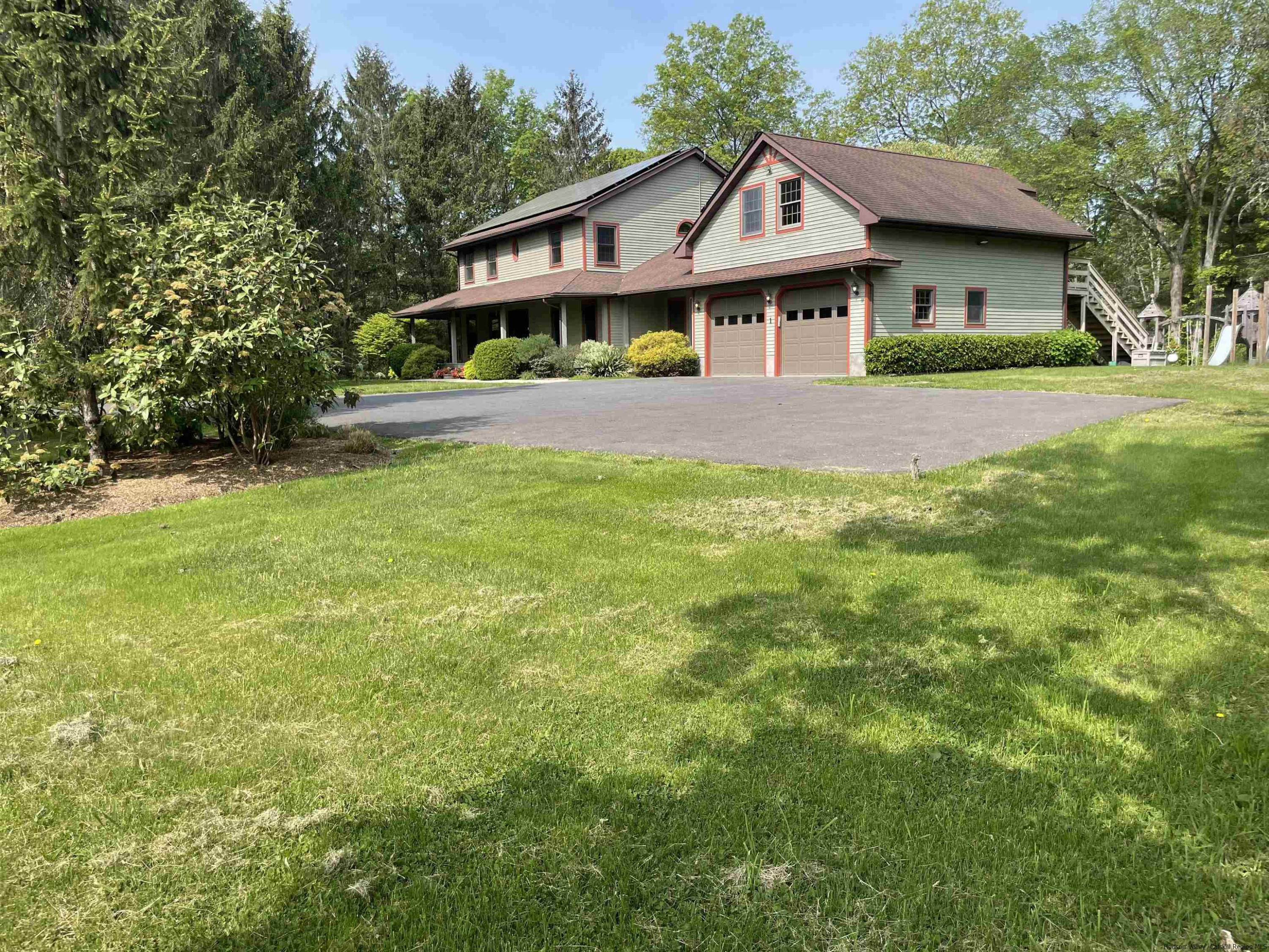 1 High Ridge Road, Unit KLEINKILL DR New Paltz, NY 12561 - Photo 3 of 30 a front view of a house with garden