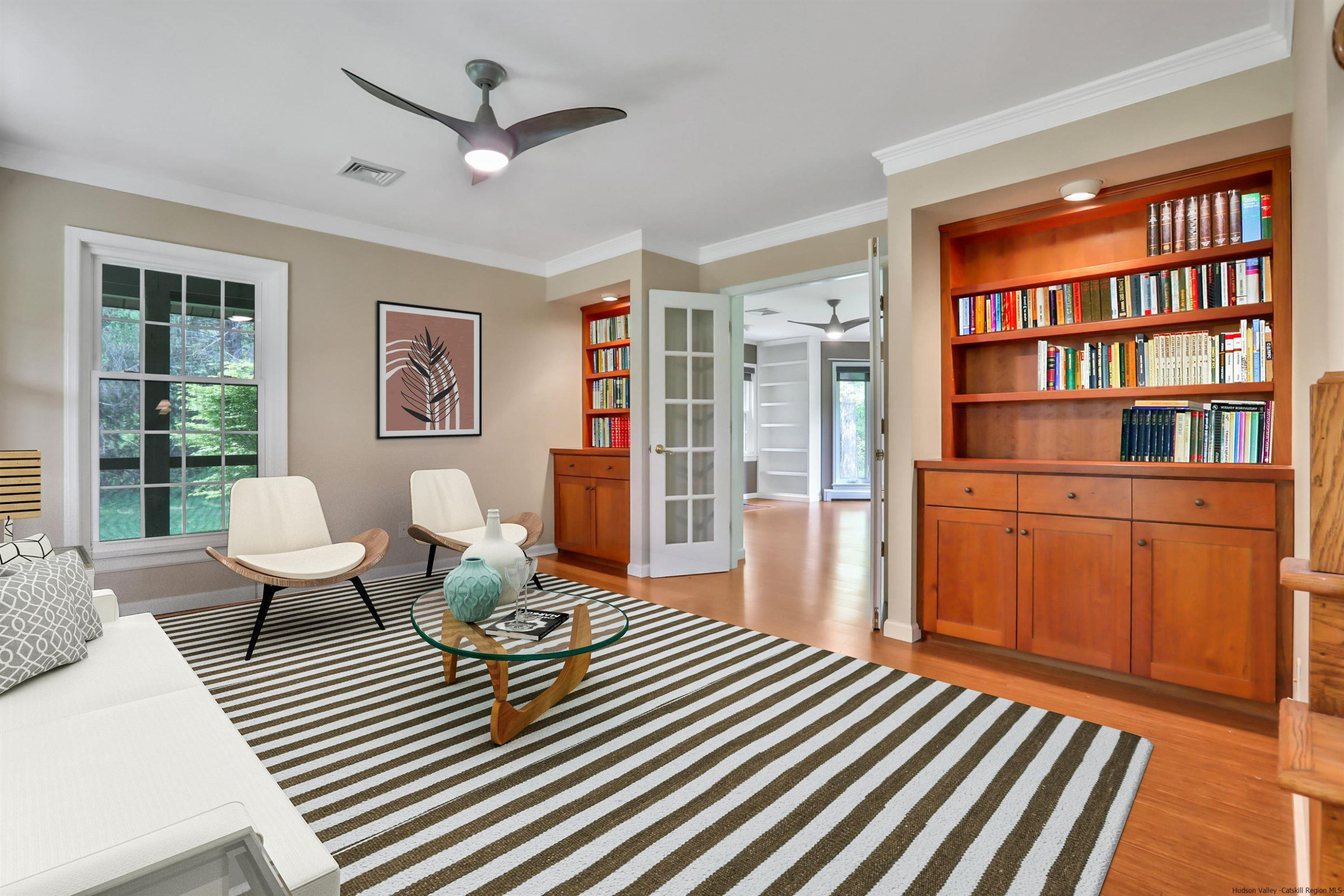 1 High Ridge Road, Unit KLEINKILL DR New Paltz, NY 12561 - Photo 9 of 30 a living room with furniture a table and wooden floor
