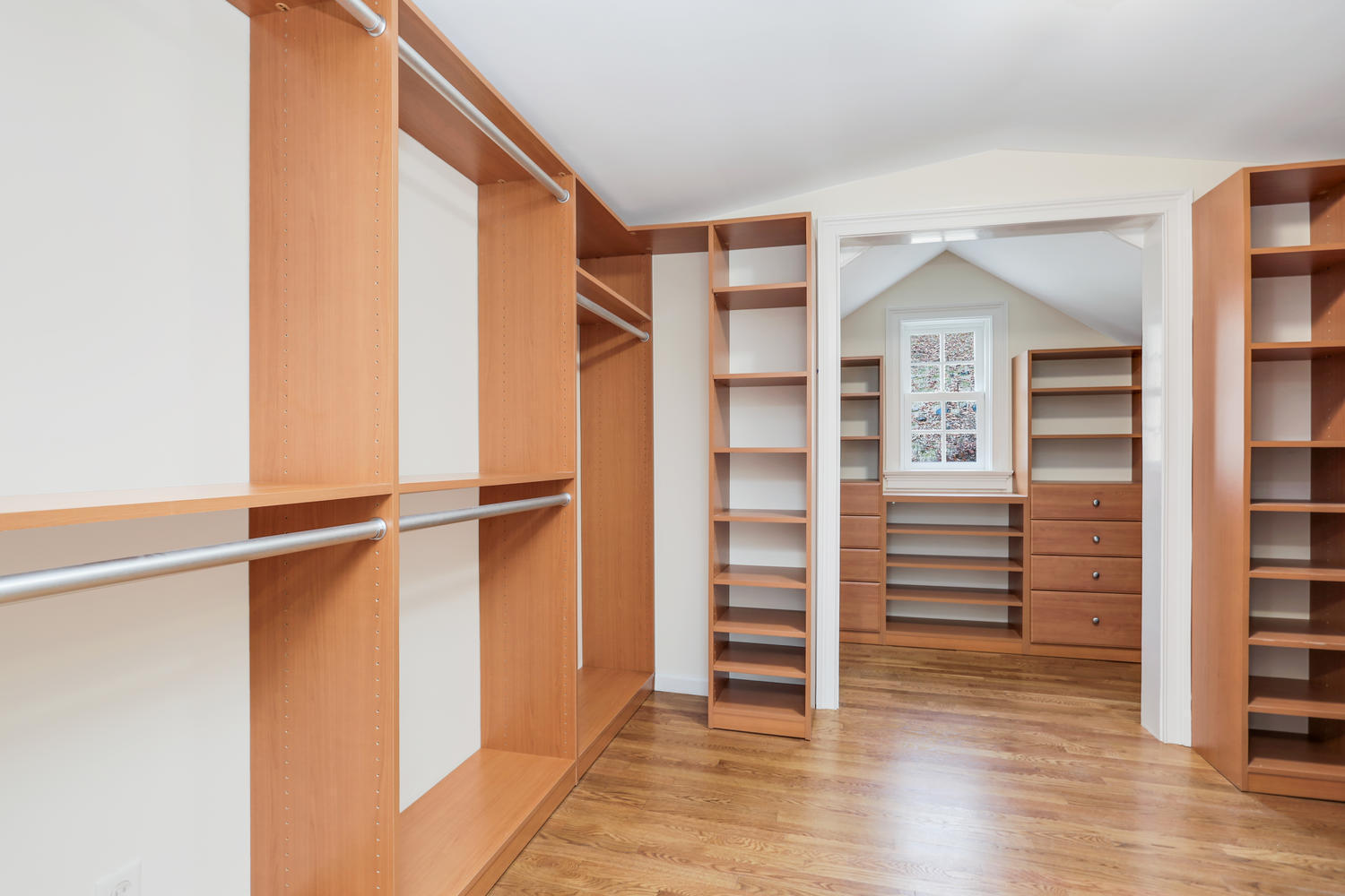 62 Salem Road New Canaan, CT 06840 - Photo 11 of 17 a view of walk in closet with empty racks