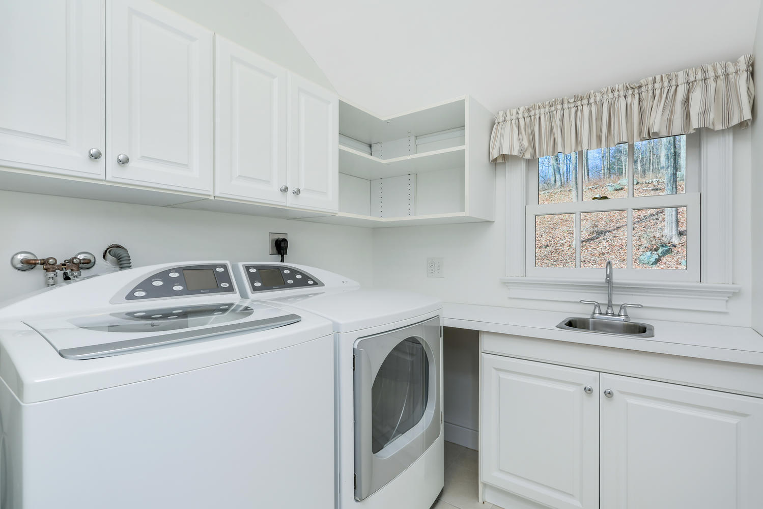 62 Salem Road New Canaan, CT 06840 - Photo 12 of 17 a utility room with sink dryer and washer