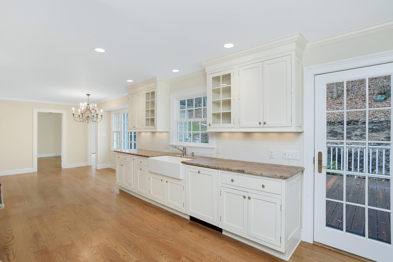 62 Salem Road New Canaan, CT 06840 - Photo 6 of 17 a large white kitchen with cabinets