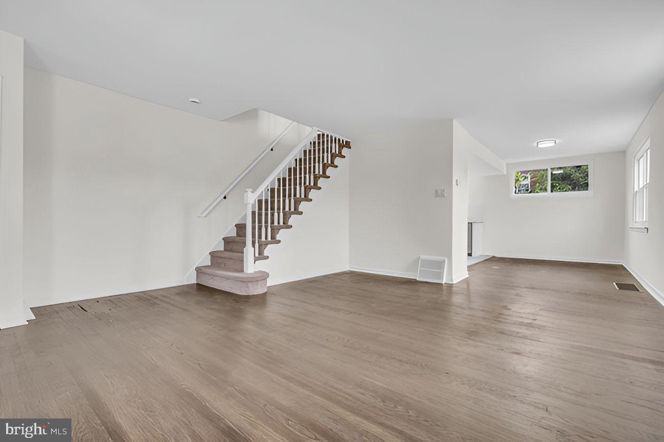 1300 East Sharpnack Street Philadelphia, PA 19150 - Photo 11 of 31 a view of an empty room with wooden floor and a window