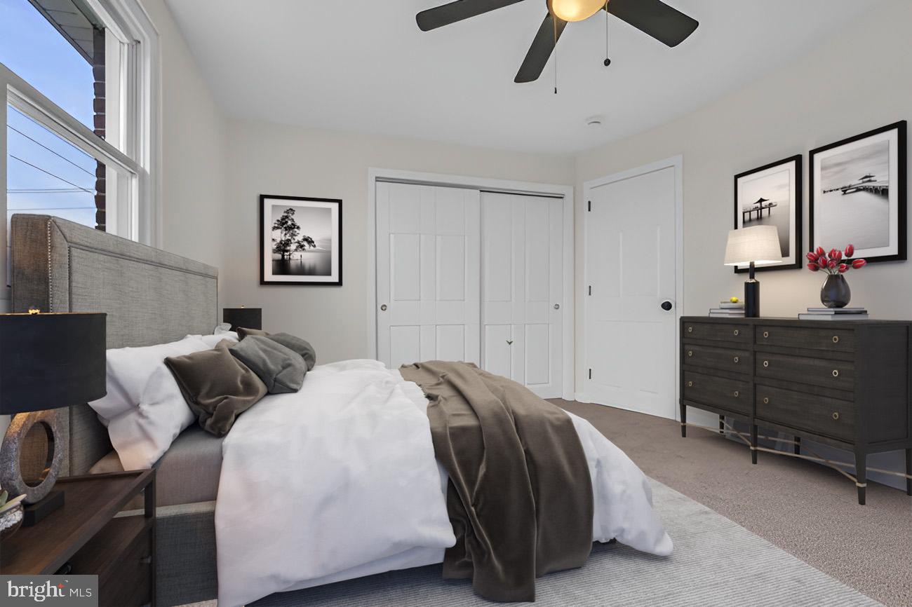 1300 East Sharpnack Street Philadelphia, PA 19150 - Photo 12 of 31 a bedroom with a bed and ceiling fan