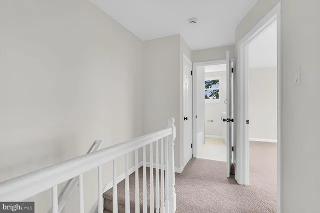 a view of a hallway with closet area