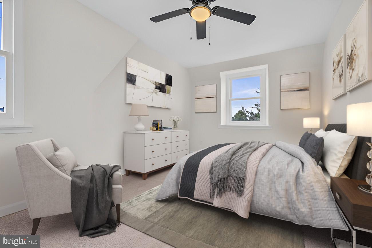 1300 East Sharpnack Street Philadelphia, PA 19150 - Photo 17 of 31 a bedroom with a bed and window