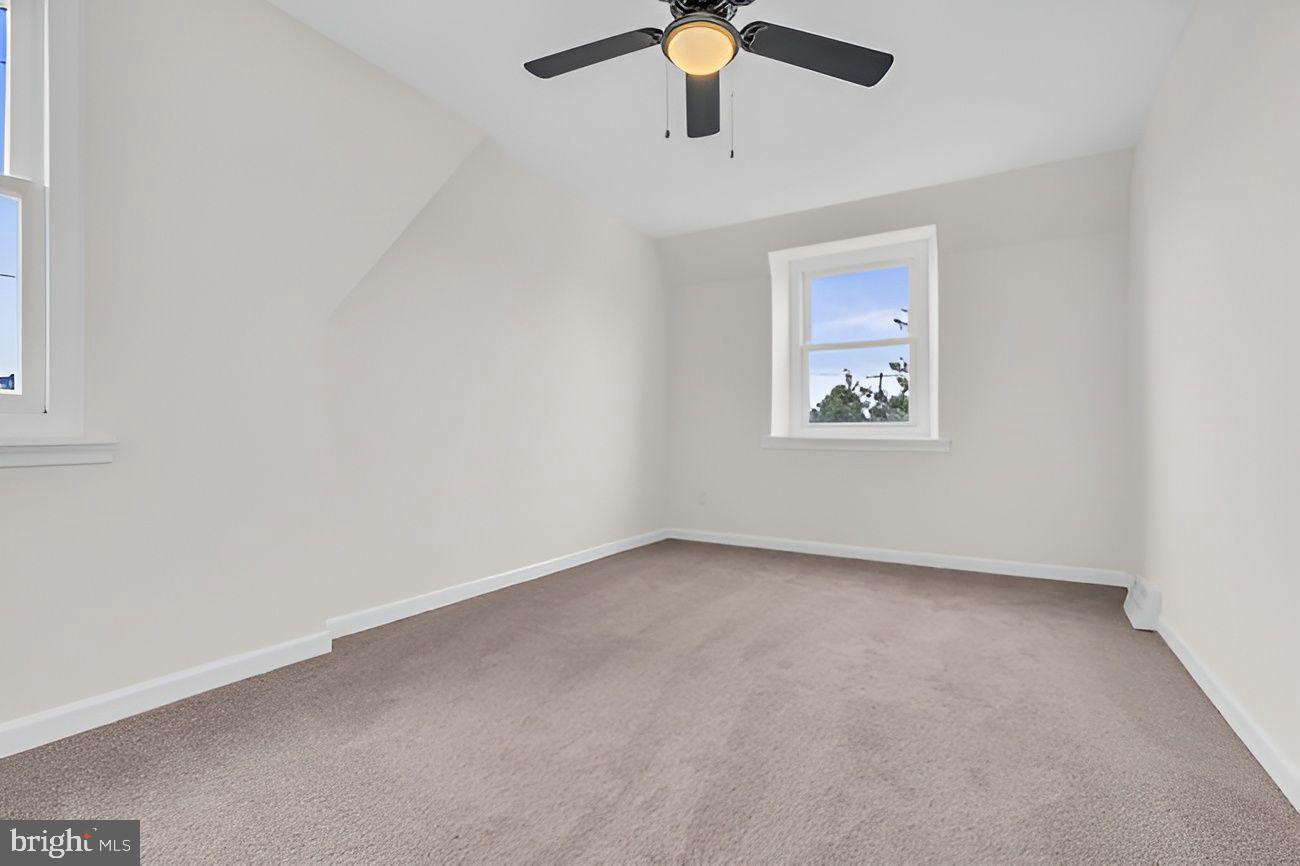 1300 East Sharpnack Street Philadelphia, PA 19150 - Photo 18 of 31 an empty room with a window