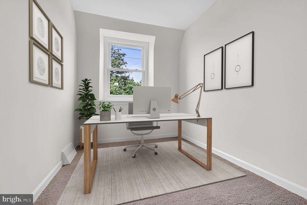 1300 East Sharpnack Street Philadelphia, PA 19150 - Photo 20 of 31 a view of a workspace with furniture and a window