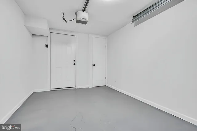 a view of a brick building next to a yard