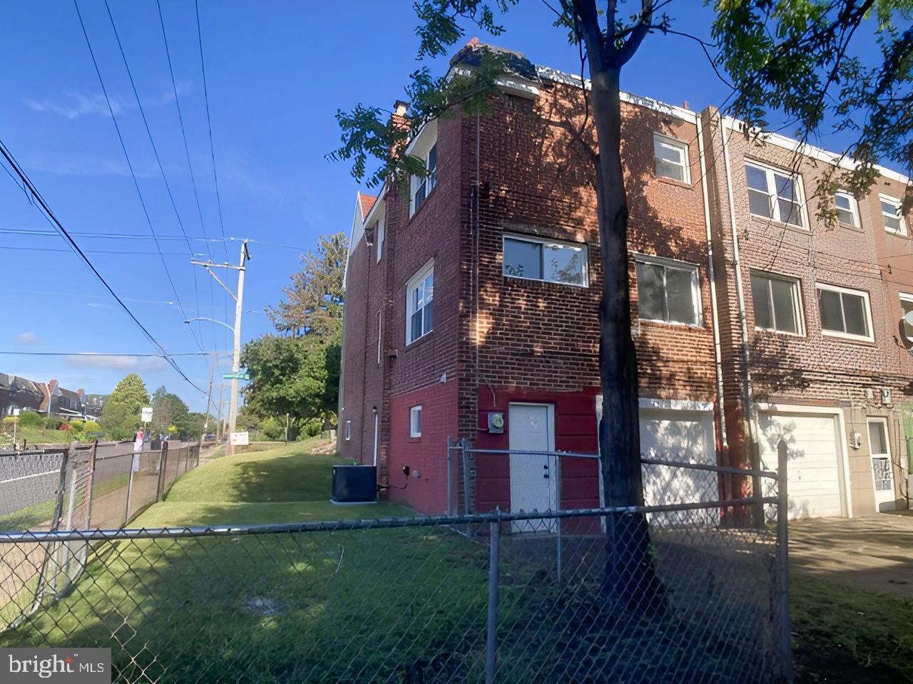 1300 East Sharpnack Street Philadelphia, PA 19150 - Photo 29 of 31 a view of a brick building next to a yard
