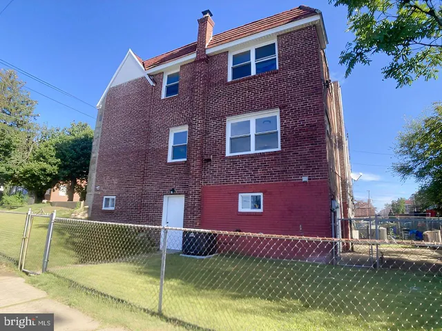 a view of a building with a garden