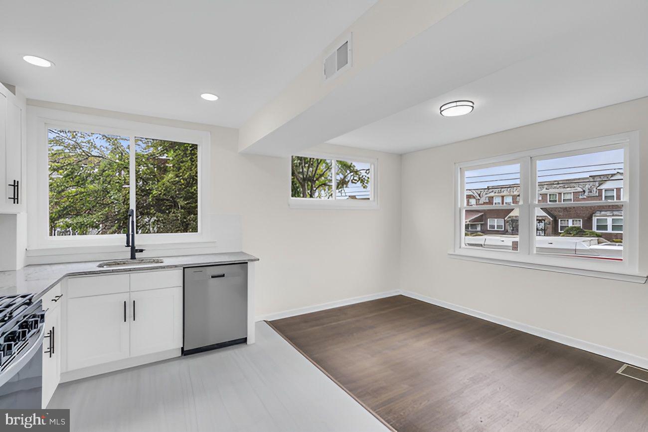 1300 East Sharpnack Street Philadelphia, PA 19150 - Photo 7 of 31 a view of cabinets a sink and a window in a room