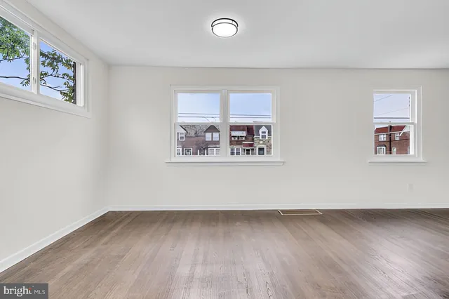 an empty room with a bench