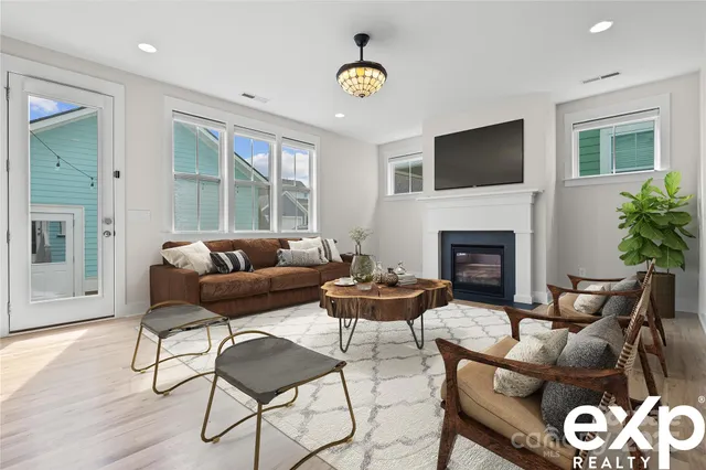 a living room with furniture and a fireplace