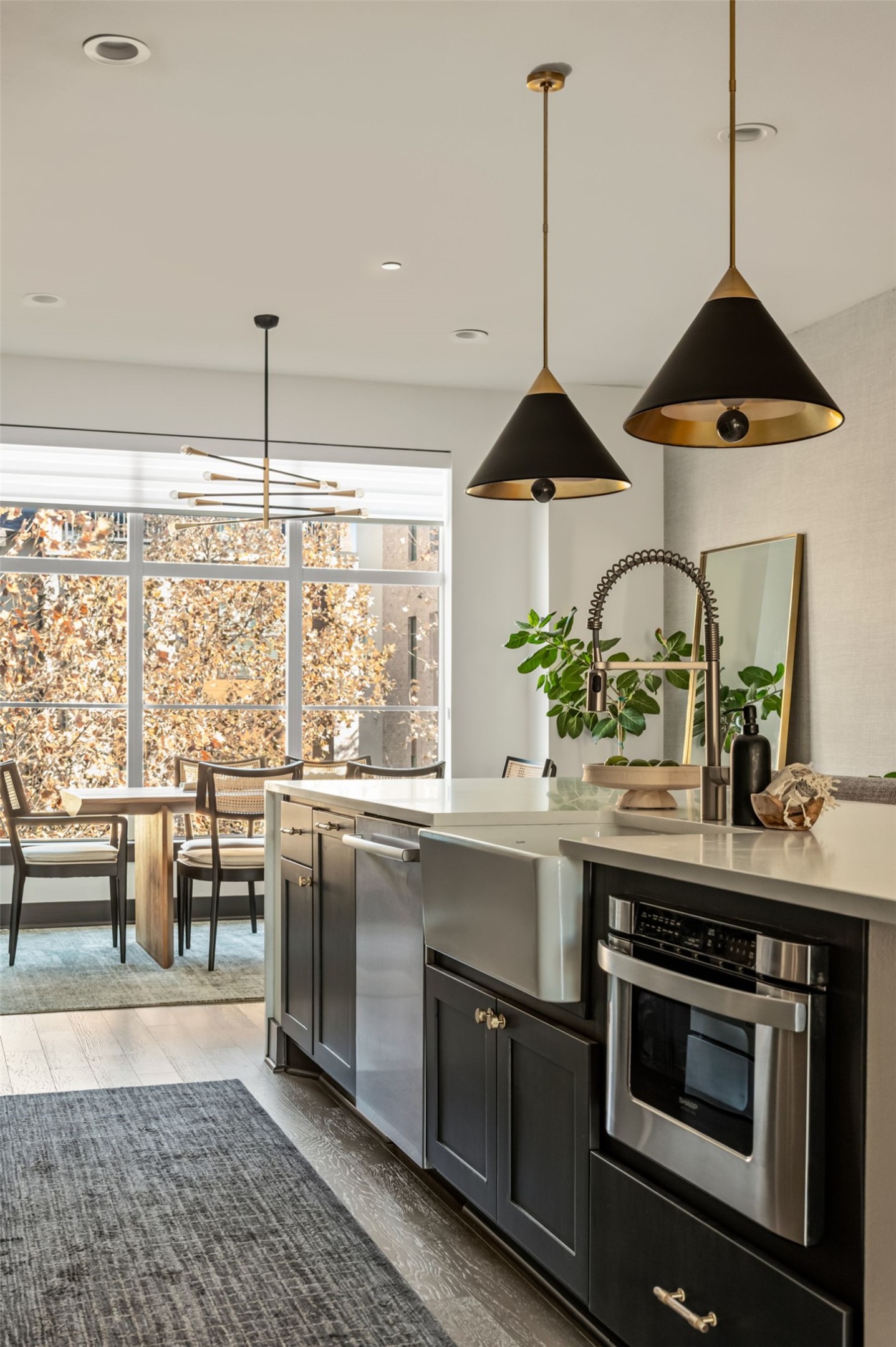 4507 Unity Circle Austin, TX 78731 - Photo 13 of 39 a kitchen with stainless steel appliances granite countertop a sink a stove and a wooden floors