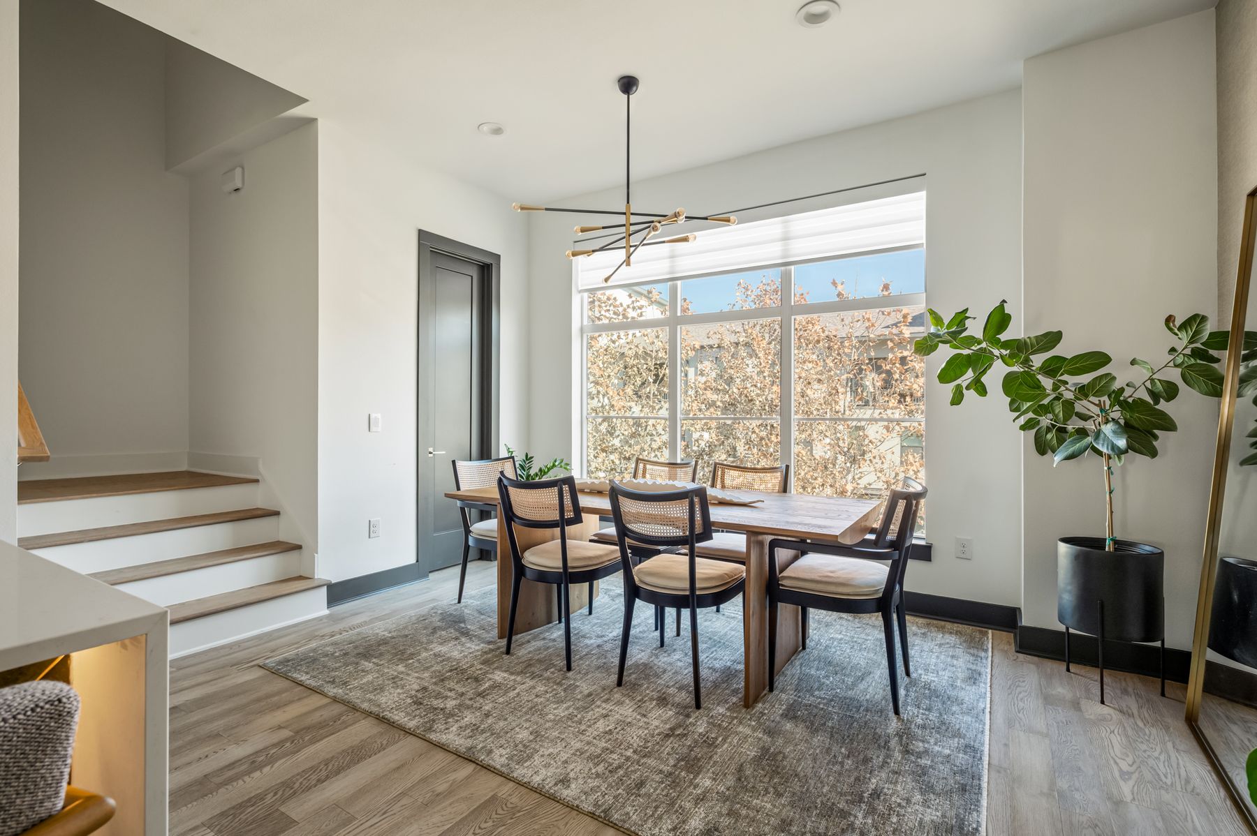 4507 Unity Circle Austin, TX 78731 - Photo 18 of 39 a dining room with furniture potted plants and wooden floor