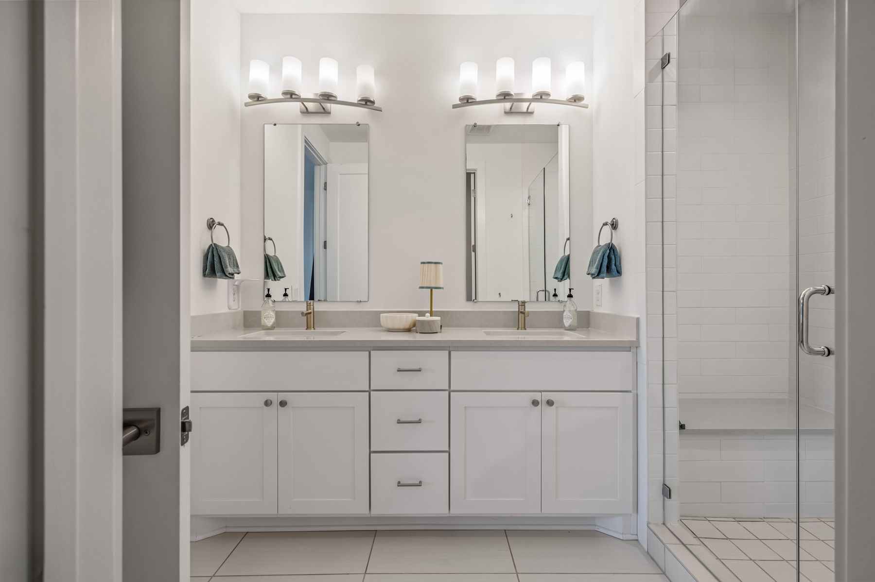 4507 Unity Circle Austin, TX 78731 - Photo 27 of 39 a bathroom with double sink and a mirror