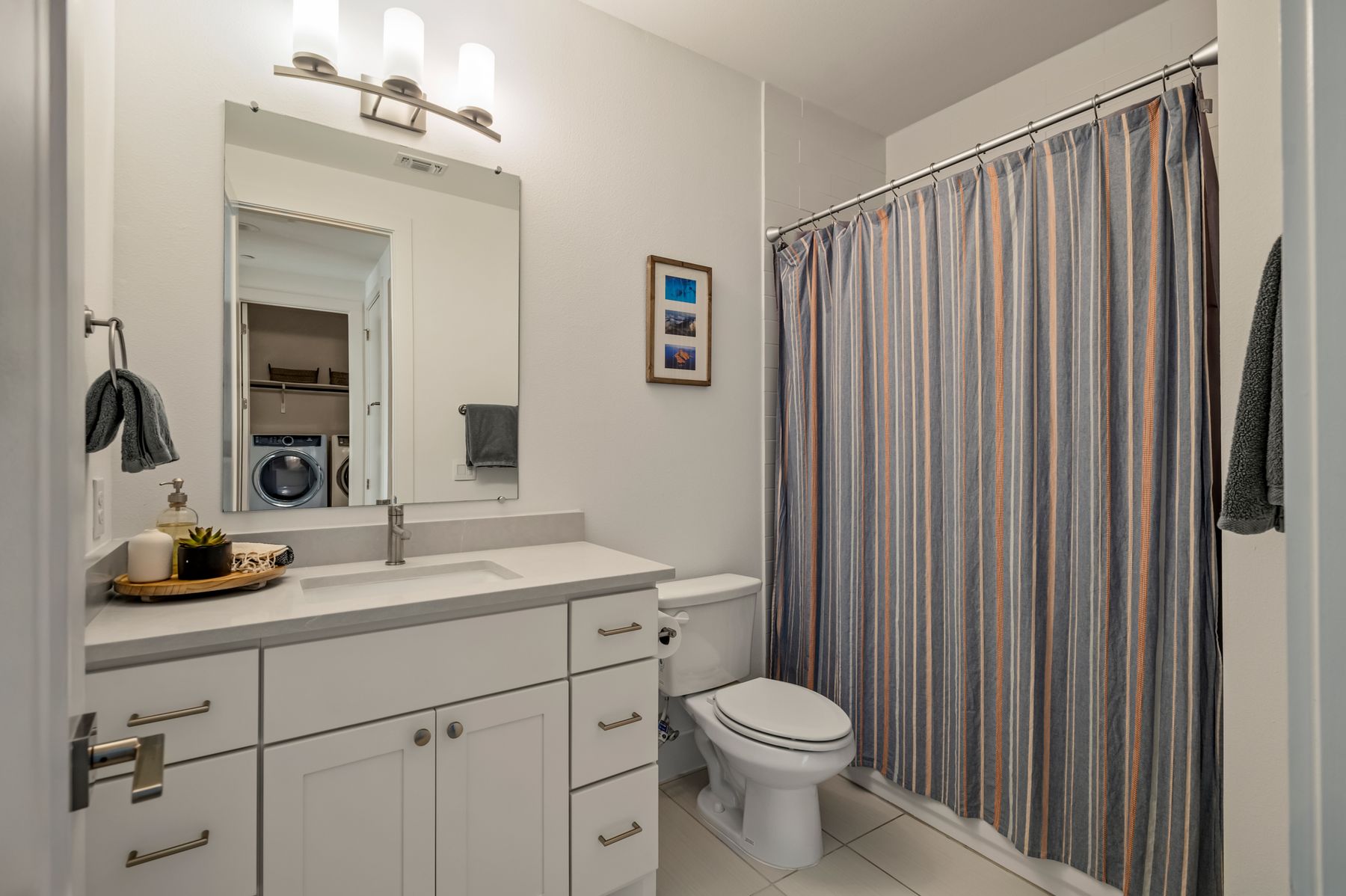 4507 Unity Circle Austin, TX 78731 - Photo 29 of 39 a bathroom with a toilet a sink and mirror