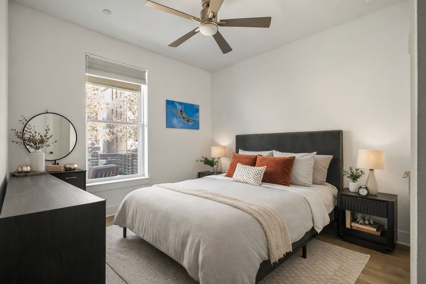 4507 Unity Circle Austin, TX 78731 - Photo 5 of 39 a bedroom with a bed a window and a chandelier