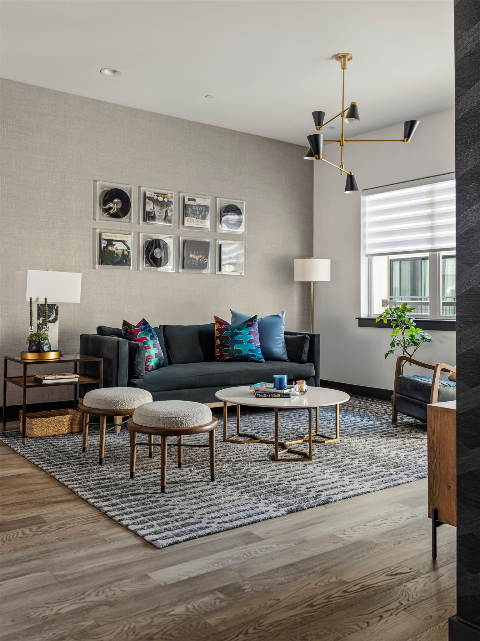 4507 Unity Circle Austin, TX 78731 - Photo 9 of 39 a living room with furniture wooden floor and a potted plant