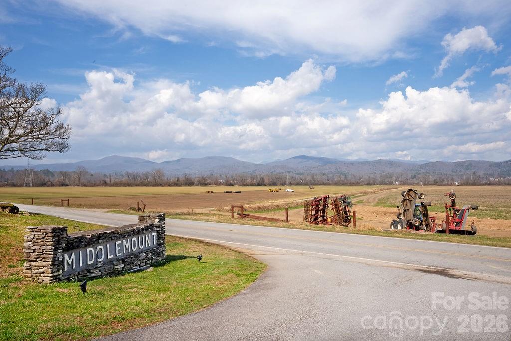 Lot 4 Middlemount Road Pisgah Forest, NC 28768 - Photo 7 of 12 a view of a swimming pool with an outdoor seating a yard and lake view