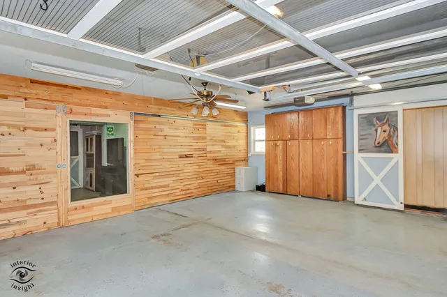 wooden floor in an empty room with a window and wooden floor