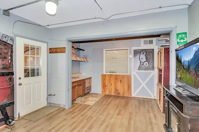 a view of a livingroom with wooden floor