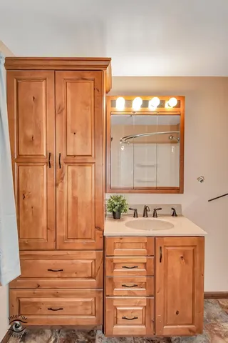 a bathroom with a white toilet and a shower