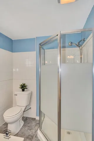 a front view of a house with plants