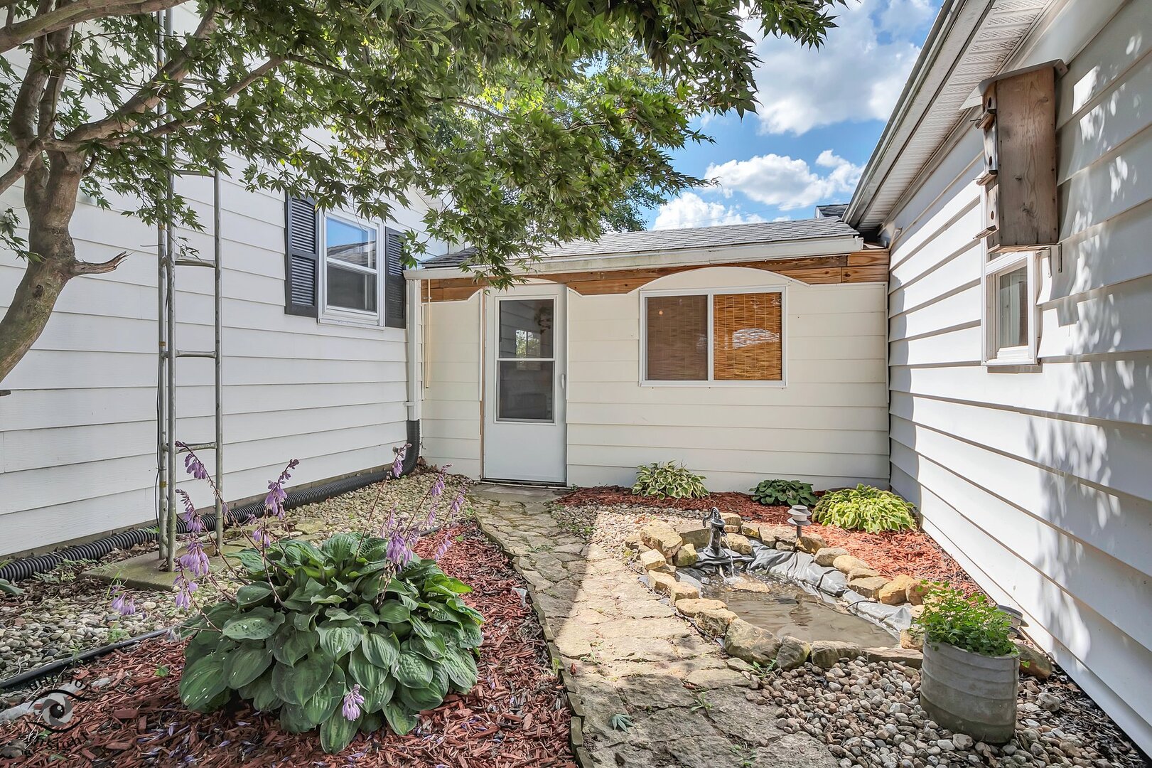 2434 North 7000 Road West Bonfield, IL 60913 - Photo 24 of 36 a front view of a house with plants