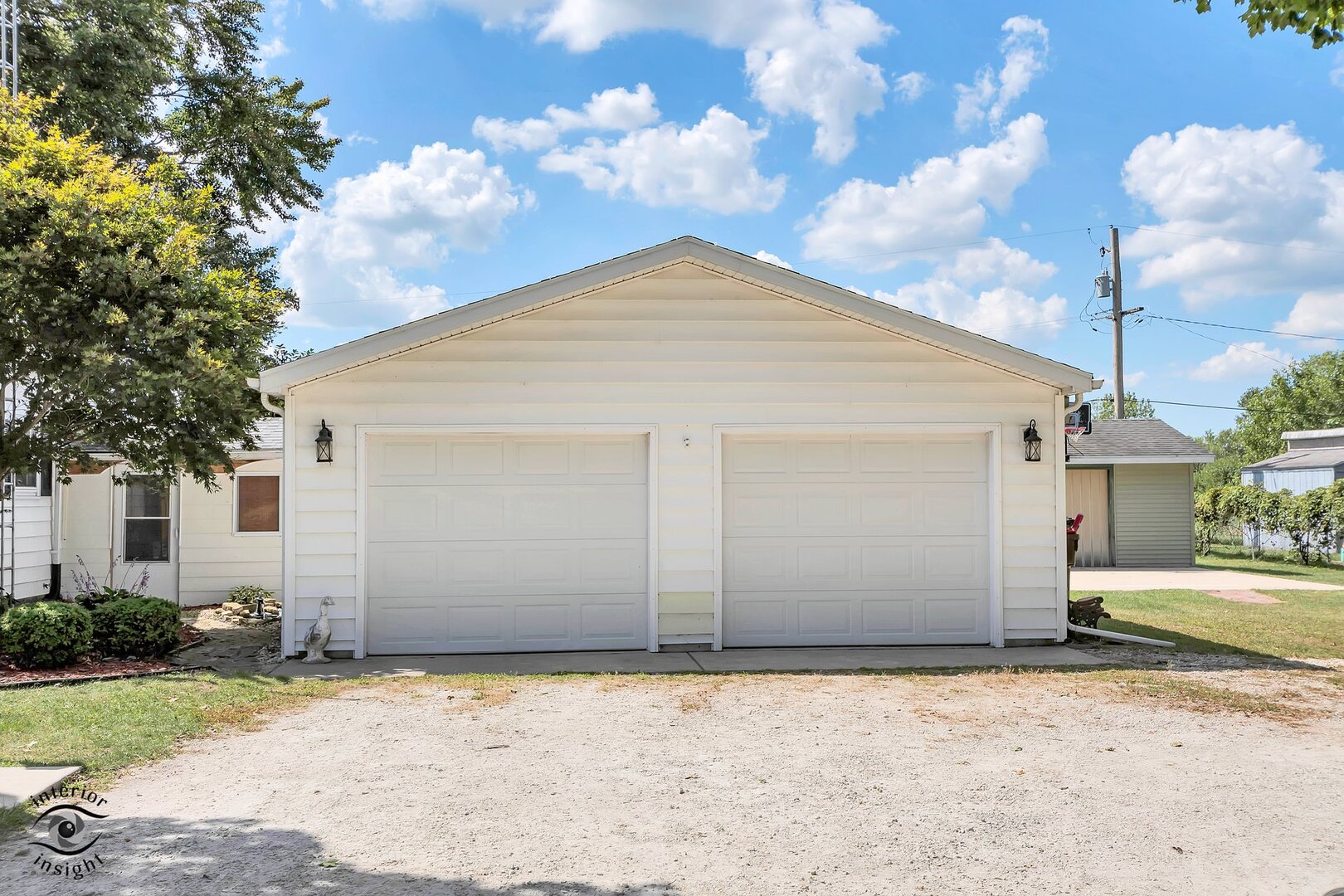 2434 North 7000 Road West Bonfield, IL 60913 - Photo 25 of 36 a front view of a house with a yard and garage