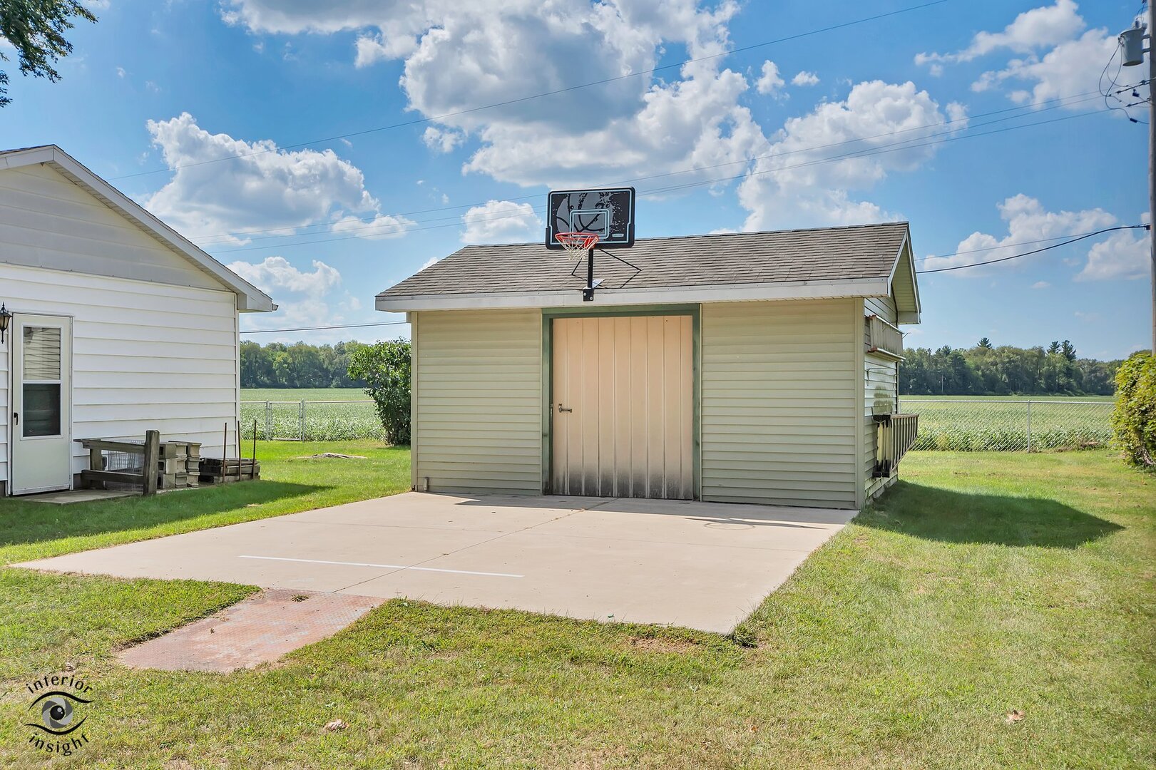 2434 North 7000 Road West Bonfield, IL 60913 - Photo 26 of 36 a front view of a house with a yard and garage