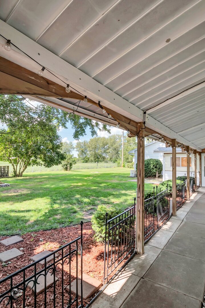 2434 North 7000 Road West Bonfield, IL 60913 - Photo 6 of 36 a view of a porch and garden