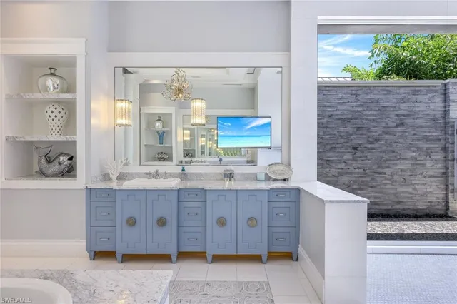 a bathroom with a granite countertop double vanity sink mirror and