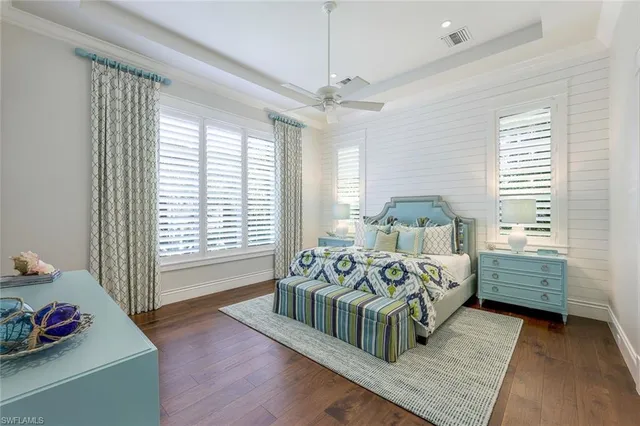 a bed room with bed and a window