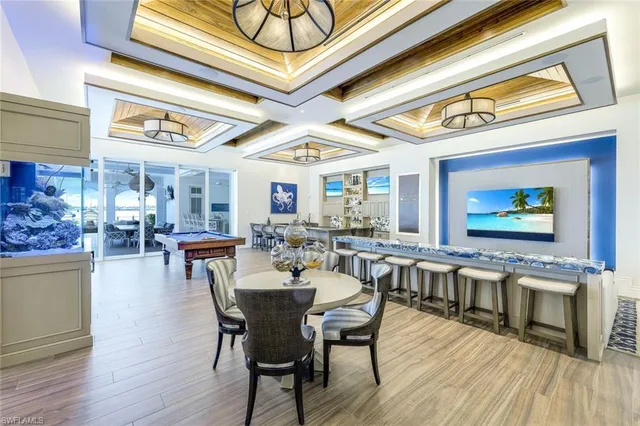 a view of a dining area with furniture window and wooden floor