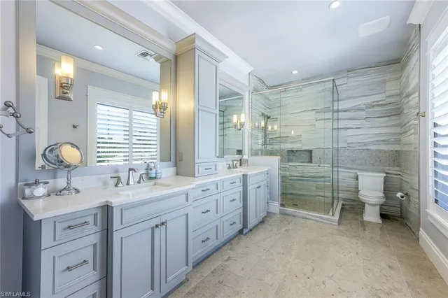 a bathroom with double vanity sink and mirror